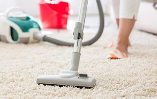 vacuum cleaning of a carpet during an end of tenancy cleaning in wimbledon